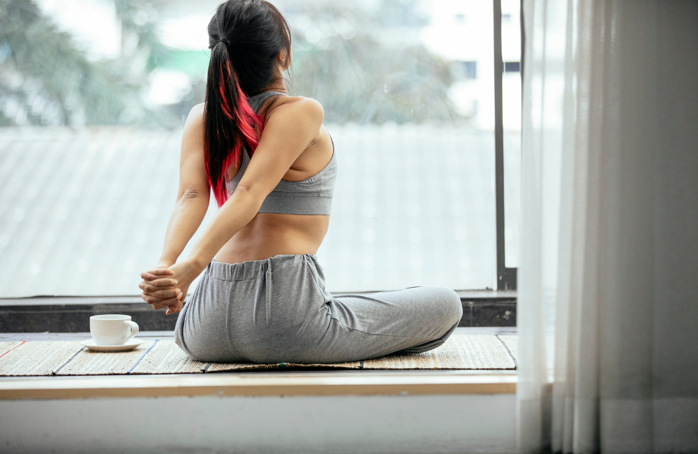 A girl is stretching after HCL Breakthrough supplements